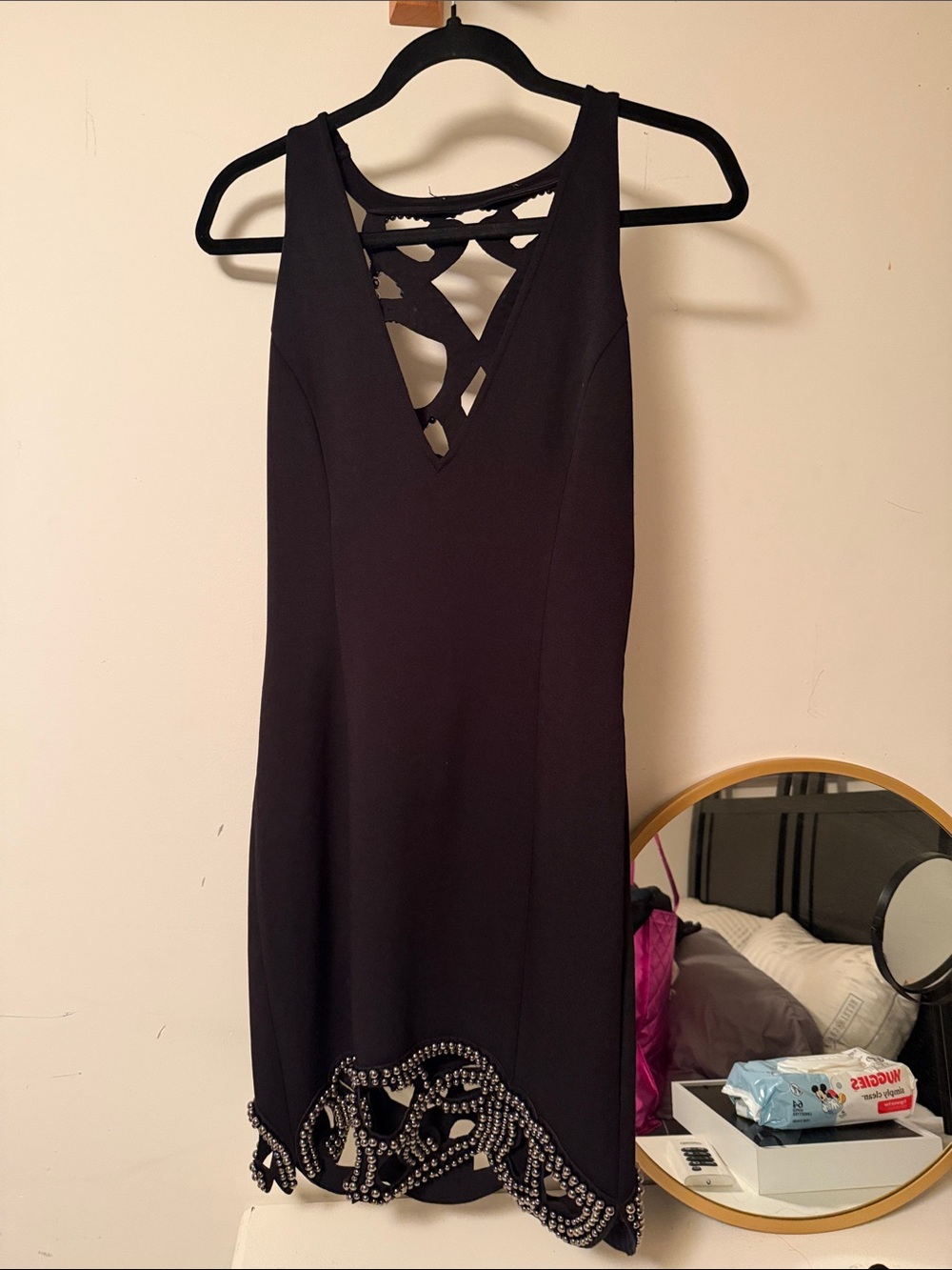 Black Sleeveless V-Neck Dress with Embellished Hem